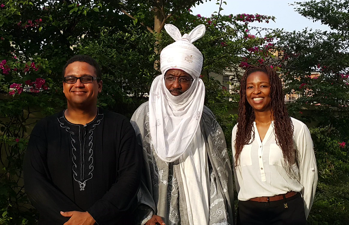 Lola Masha at a leadership meeting with a traditional ruler and a colleague