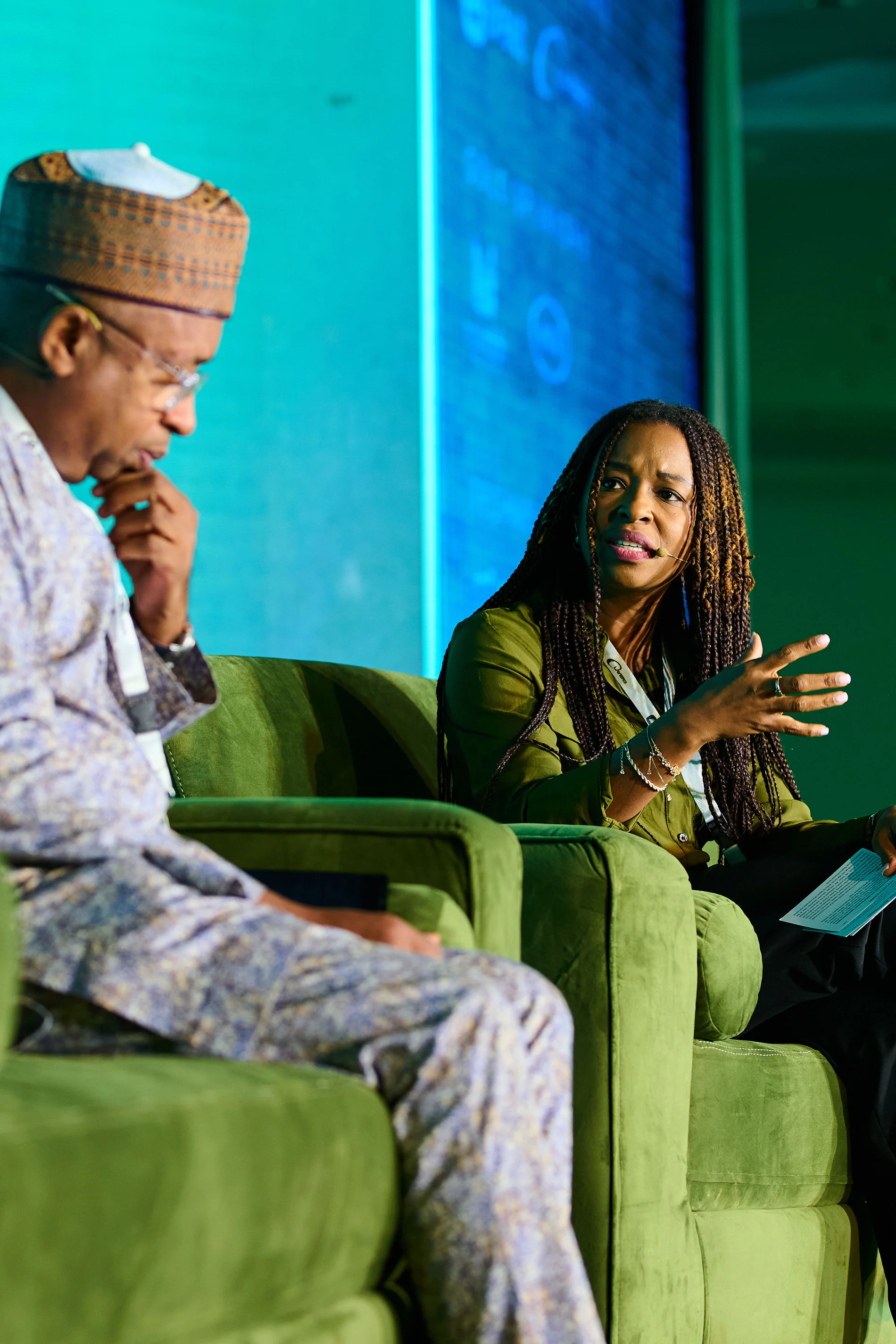 Lola Masha speaking during a panel conversation on stage
